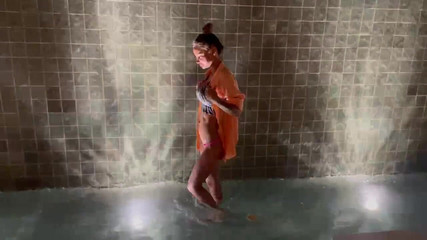 Monika Fox Is Walking Near the Water Wall