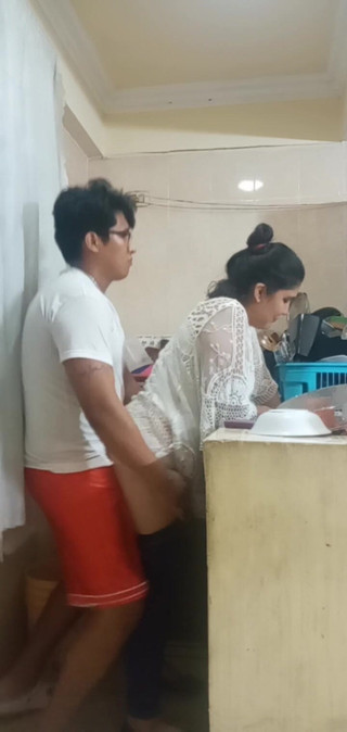 Maid Fucked When She Washes the Dishes in the Kitchen