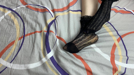 Caressing Long Legs of Girl in Black Lace Socks