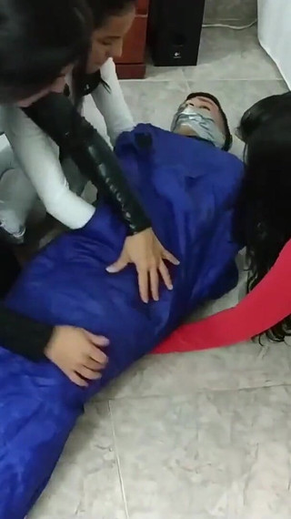 Latino Hunk Heavily Mummified by Cooperative Femdom Women