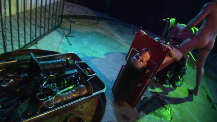 Slutty Brunette in a Cage Gets Fucked in a Double Penetration