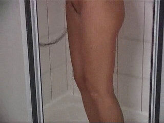 Busty brunette babe is having a shower