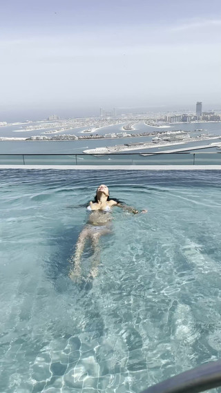 Monika Fox Poses in Bikini & Swims in Pool on Roof of Hotel