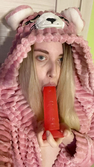 Girl in cute outfit suck dildo