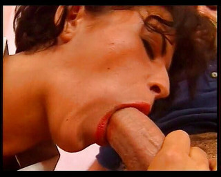 Mature hottie sucking on his cock in the chair