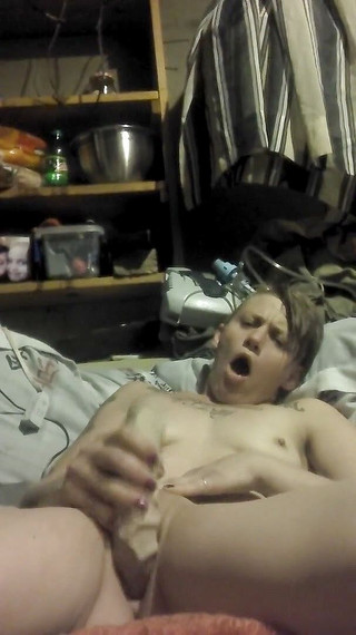 Her breasts are small and flat and her pussy is ready to take a big dildo