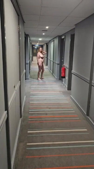 Naked in the Village Hotel Corridor