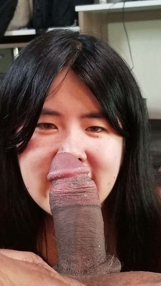 Chinese Girl Fits Her Tiny Mouth Around a Thick Black Cock