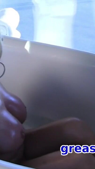 Oiled up blonde milf with big tits fucks pussy with glass dildo