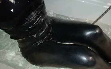 Girl in Leather Leggings in a Bathtub