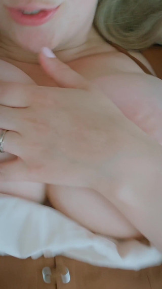 Big Wife Holds Her Huge Breasts as Something Exciting Happens