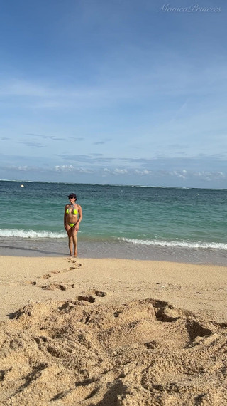 Teasing on the Beach in Micro Bikini on the Sand