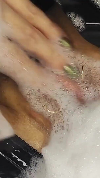 Taking a Bath in a Back Latex Catsuit