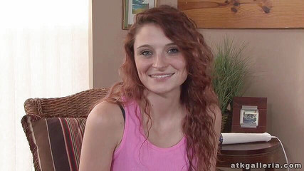 Redhead beauty enjoys toying her shaved twat