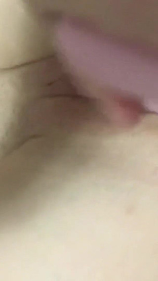 Sweet girl in fishnets using a dildo to fuck her pussy