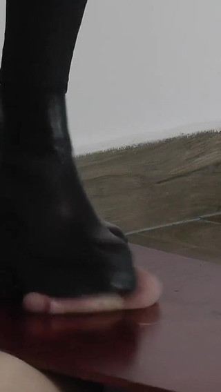 The Orgasm of a Slave Under Mistress Cassy's Boots