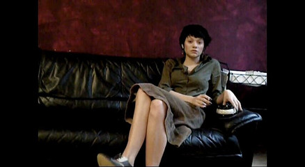 Black haired teen smoking a cigarette