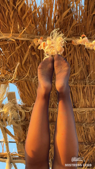 The Best View on the Beach Is Not the Sea, but My Feet in Black Tights Hanging Over Your Head