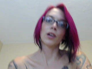 Tattooed redhead babe masturbating on cam