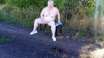 A Neighbor in the Park Undresses and Masturbates to Orgasm on a Bench