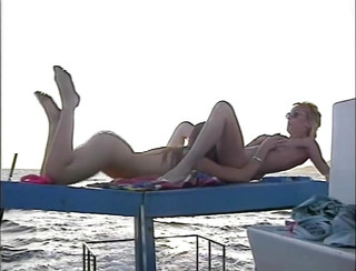 Lesbians pussy licking fingering on the beach