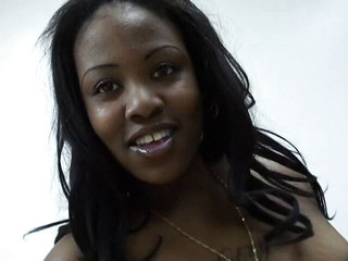 Big booty slut with orange fishnets poses for the camera