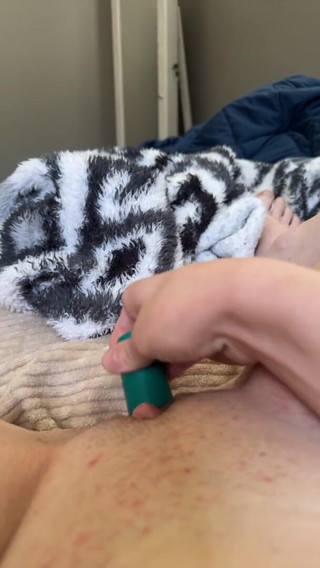 Young Female Using Vibrator to Masturbate