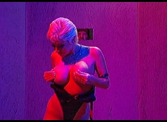 Blonde milf plays with two cocks at glory hole