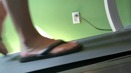 Feet in Flip Flops on the Treadmill - Ivys Feet