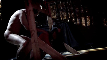 Busty milf in leather and fishnets seduces man in the dungeon