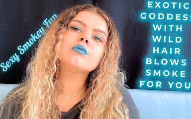 Exotic Goddess with Wild Hair Blows Smoke for You