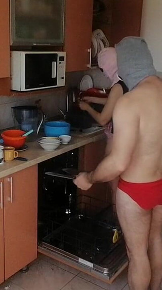 Couple Having Fun in the Kitchen. Sexy Wife Doing Chores in the House Naked